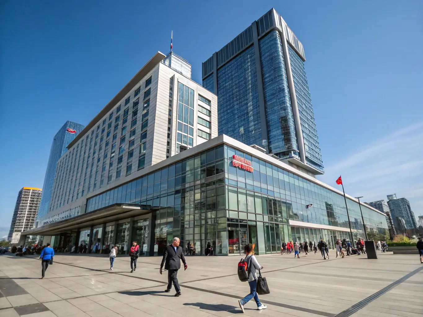 A well-maintained commercial building exterior in winter, showcasing facility management services by Hausmeisterservice Abboud, with snow cleared pathways and a tidy landscape.